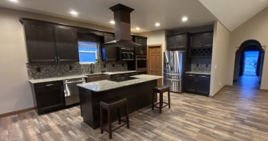 Brand new construction, fully landscaped. Located in Hidden on Hidden Bridge Golf Club in Wyoming - for sale on GolfHomes.com, golf home, golf lot