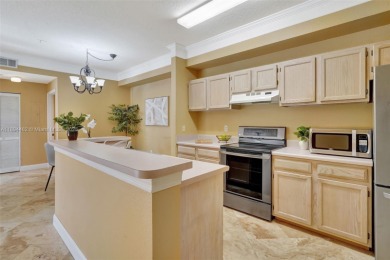 BRIGHT AND BEAUTIFULLY PRESENTED 2 BED / 2 BATH CONDO IN ROYAL on Gateway Golf and Country Club in Florida - for sale on GolfHomes.com, golf home, golf lot