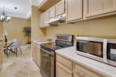 BRIGHT AND BEAUTIFULLY PRESENTED 2 BED / 2 BATH CONDO IN ROYAL on Gateway Golf and Country Club in Florida - for sale on GolfHomes.com, golf home, golf lot