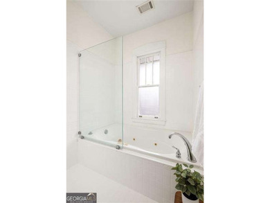 Perched proudly atop a hill in the heart of Candler Park, this on Candler Park Golf Course in Georgia - for sale on GolfHomes.com, golf home, golf lot