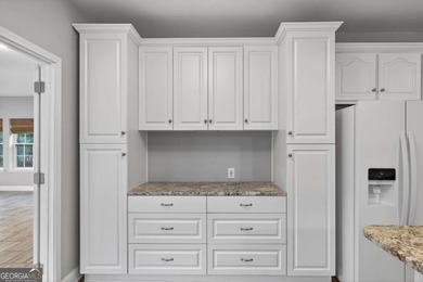 Tucked inside the gated, resort-style community of Fairfield on Fairfield Plantation Golf and Country Club in Georgia - for sale on GolfHomes.com, golf home, golf lot