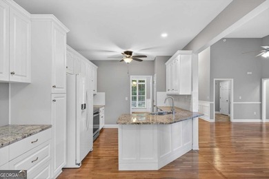 Tucked inside the gated, resort-style community of Fairfield on Fairfield Plantation Golf and Country Club in Georgia - for sale on GolfHomes.com, golf home, golf lot