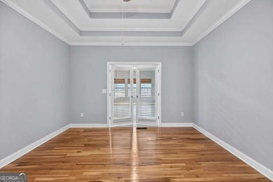 Tucked inside the gated, resort-style community of Fairfield on Fairfield Plantation Golf and Country Club in Georgia - for sale on GolfHomes.com, golf home, golf lot