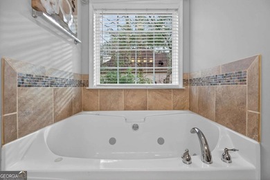 Tucked inside the gated, resort-style community of Fairfield on Fairfield Plantation Golf and Country Club in Georgia - for sale on GolfHomes.com, golf home, golf lot