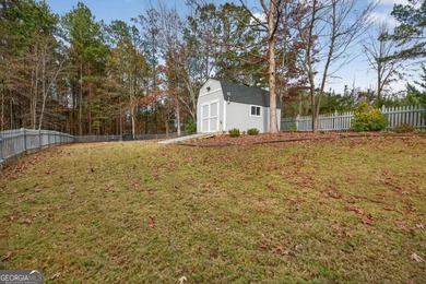 Tucked inside the gated, resort-style community of Fairfield on Fairfield Plantation Golf and Country Club in Georgia - for sale on GolfHomes.com, golf home, golf lot