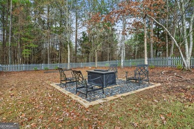 Tucked inside the gated, resort-style community of Fairfield on Fairfield Plantation Golf and Country Club in Georgia - for sale on GolfHomes.com, golf home, golf lot