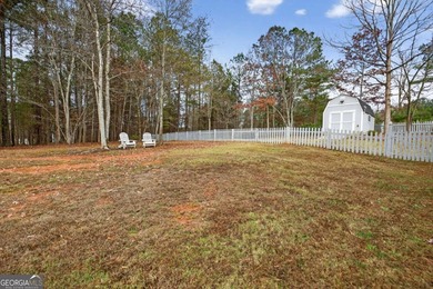 Tucked inside the gated, resort-style community of Fairfield on Fairfield Plantation Golf and Country Club in Georgia - for sale on GolfHomes.com, golf home, golf lot
