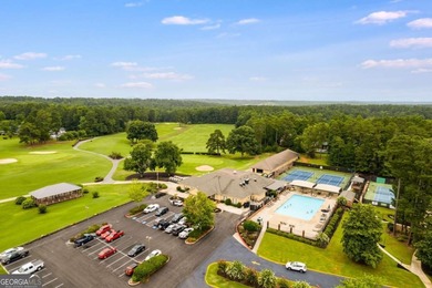 Tucked inside the gated, resort-style community of Fairfield on Fairfield Plantation Golf and Country Club in Georgia - for sale on GolfHomes.com, golf home, golf lot