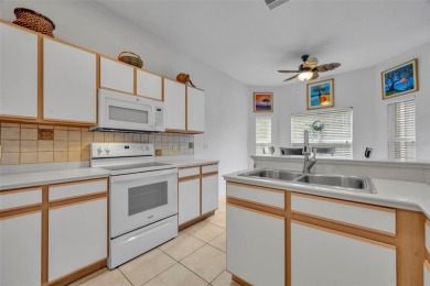 Presenting a well-maintained 2-bedroom, 2-bathroom home with an on Lake Ashton Golf Club in Florida - for sale on GolfHomes.com, golf home, golf lot