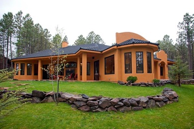 Perfectly positioned on the 10th green of the Angel Fire Resort on Angel Fire Resort Country Club in New Mexico - for sale on GolfHomes.com, golf home, golf lot