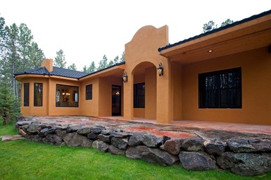 Perfectly positioned on the 10th green of the Angel Fire Resort on Angel Fire Resort Country Club in New Mexico - for sale on GolfHomes.com, golf home, golf lot