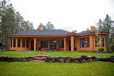 Perfectly positioned on the 10th green of the Angel Fire Resort on Angel Fire Resort Country Club in New Mexico - for sale on GolfHomes.com, golf home, golf lot