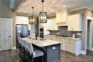 This picturesque home in the gated section of Kings Grant golf on Kings Grant Golf and Country Club in North Carolina - for sale on GolfHomes.com, golf home, golf lot