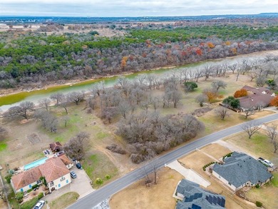 Nestled on nearly two acres with rare Brazos River frontage on Pecan Plantation Country Club in Texas - for sale on GolfHomes.com, golf home, golf lot