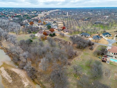 Nestled on nearly two acres with rare Brazos River frontage on Pecan Plantation Country Club in Texas - for sale on GolfHomes.com, golf home, golf lot