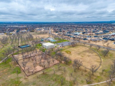 Nestled on nearly two acres with rare Brazos River frontage on Pecan Plantation Country Club in Texas - for sale on GolfHomes.com, golf home, golf lot