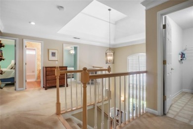 Tucked into a quiet cul-de-sac in sought-after Windward, this on The Golf Club of Georgia in Georgia - for sale on GolfHomes.com, golf home, golf lot