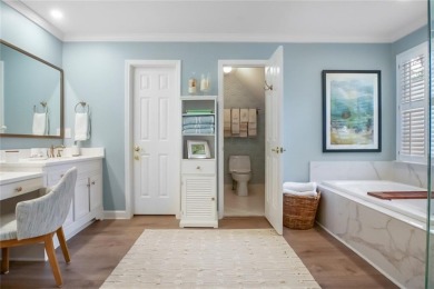 Tucked into a quiet cul-de-sac in sought-after Windward, this on The Golf Club of Georgia in Georgia - for sale on GolfHomes.com, golf home, golf lot