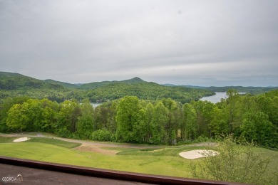 Perched above Lake Burton overlooking stunning views of the lake on Waterfall Country Club in Georgia - for sale on GolfHomes.com, golf home, golf lot