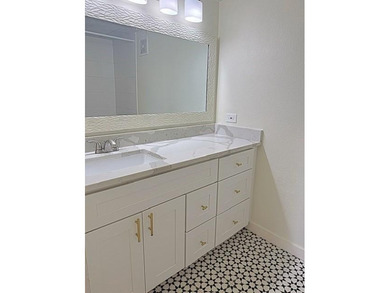 This modern updated condo offers quartz counters, cement tile on Las Colinas Country Club in Texas - for sale on GolfHomes.com, golf home, golf lot