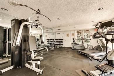 This modern updated condo offers quartz counters, cement tile on Las Colinas Country Club in Texas - for sale on GolfHomes.com, golf home, golf lot