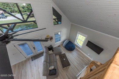 74 Blue Herring Drive offers a harmonious blend of comfort and on  in Tennessee - for sale on GolfHomes.com, golf home, golf lot