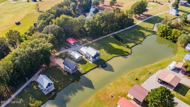 74 Blue Herring Drive offers a harmonious blend of comfort and on Tennessee River Golf Club in Tennessee - for sale on GolfHomes.com, golf home, golf lot