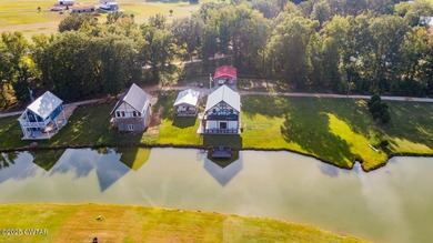 74 Blue Herring Drive offers a harmonious blend of comfort and on Tennessee River Golf Club in Tennessee - for sale on GolfHomes.com, golf home, golf lot