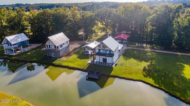 74 Blue Herring Drive offers a harmonious blend of comfort and on Tennessee River Golf Club in Tennessee - for sale on GolfHomes.com, golf home, golf lot