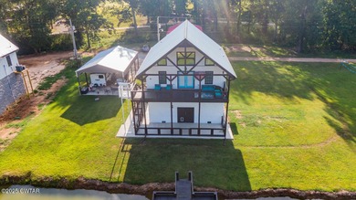 74 Blue Herring Drive offers a harmonious blend of comfort and on Tennessee River Golf Club in Tennessee - for sale on GolfHomes.com, golf home, golf lot