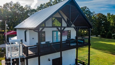 74 Blue Herring Drive offers a harmonious blend of comfort and on Tennessee River Golf Club in Tennessee - for sale on GolfHomes.com, golf home, golf lot