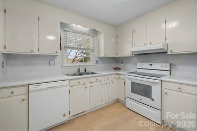 Set along a golf-course setting with a generous lot and room to on  in North Carolina - for sale on GolfHomes.com, golf home, golf lot