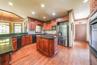 Magnificent four sides brick home with sweeping golf course on TPC At Sugarloaf Golf Club in Georgia - for sale on GolfHomes.com, golf home, golf lot