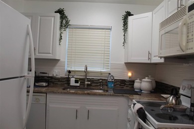 Welcome to this charming 2-bedroom, 2.5-bath condominium located on Errol Estates Country Club in Florida - for sale on GolfHomes.com, golf home, golf lot