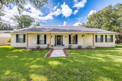 This charming white brick home has 4 bedrooms and 3 baths on Starke Golf and Country Club in Florida - for sale on GolfHomes.com, golf home, golf lot