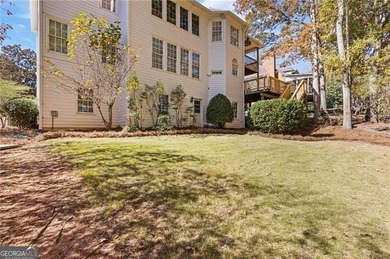 Beautiful traditional-style home with a rocking chair front on Canongate At Olde Atlanta Golf Club in Georgia - for sale on GolfHomes.com, golf home, golf lot