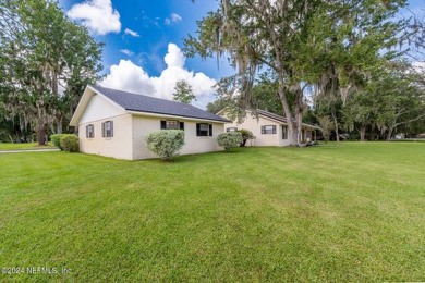 This charming white brick home has 4 bedrooms and 3 baths on Starke Golf and Country Club in Florida - for sale on GolfHomes.com, golf home, golf lot