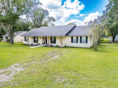 This charming white brick home has 4 bedrooms and 3 baths on Starke Golf and Country Club in Florida - for sale on GolfHomes.com, golf home, golf lot