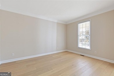 Beautiful traditional-style home with a rocking chair front on Canongate At Olde Atlanta Golf Club in Georgia - for sale on GolfHomes.com, golf home, golf lot