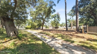 Nestled among some of the most majestic live oaks in Southport on The Lakes Country Club in North Carolina - for sale on GolfHomes.com, golf home, golf lot