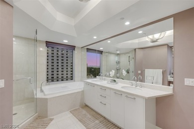 Stunning corner residence with dramatic curved floor-to-ceiling on  in Nevada - for sale on GolfHomes.com, golf home, golf lot