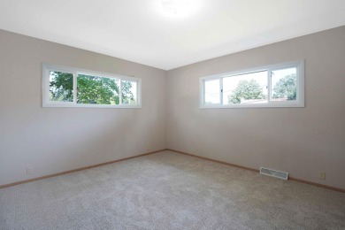This charming ranch home offers more than meets the eye! With on Irv Warren Memorial Golf Course in Iowa - for sale on GolfHomes.com, golf home, golf lot