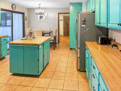 Come see this spacious 4-bedroom, 3-bath split-level, 2-story on Angel Fire Resort Country Club in New Mexico - for sale on GolfHomes.com, golf home, golf lot