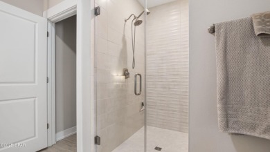 This like-new beach retreat in the quiet gated community of on Camp Creek Golf Course in Florida - for sale on GolfHomes.com, golf home, golf lot