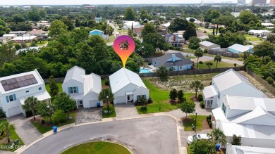 This like-new beach retreat in the quiet gated community of on Camp Creek Golf Course in Florida - for sale on GolfHomes.com, golf home, golf lot