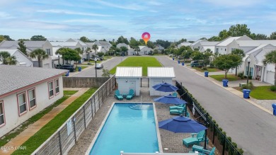 This like-new beach retreat in the quiet gated community of on Camp Creek Golf Course in Florida - for sale on GolfHomes.com, golf home, golf lot