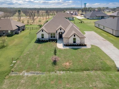 Welcome to luxury living in the prestigious, gated community of on Pecan Plantation Country Club in Texas - for sale on GolfHomes.com, golf home, golf lot