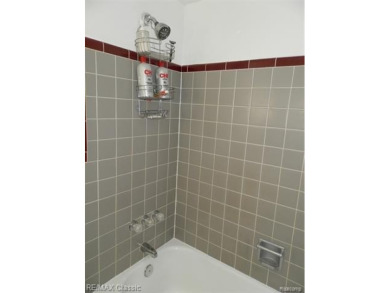 Nestled near the scenic Western Golf Course, this beautifully on Western Golf and Country Club in Michigan - for sale on GolfHomes.com, golf home, golf lot