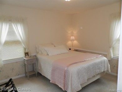 Nestled near the scenic Western Golf Course, this beautifully on Western Golf and Country Club in Michigan - for sale on GolfHomes.com, golf home, golf lot