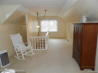 Nestled near the scenic Western Golf Course, this beautifully on Western Golf and Country Club in Michigan - for sale on GolfHomes.com, golf home, golf lot